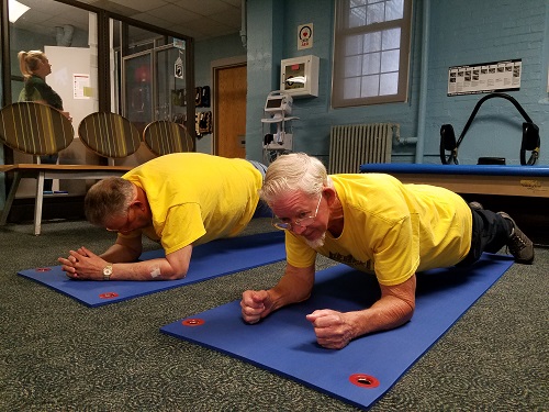 Roy Kessinger, age 69, (left), and Tommy Custer, age 78 (right) finish off their 90 minute workout session strong with some planks!
