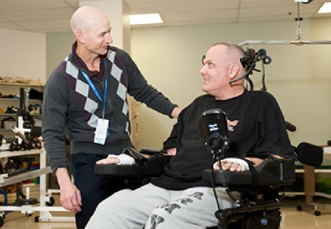 Occupational Therapist working with a Veteran in a Wheelchair Occupational Therapist working with a Veteran in a Wheelchair